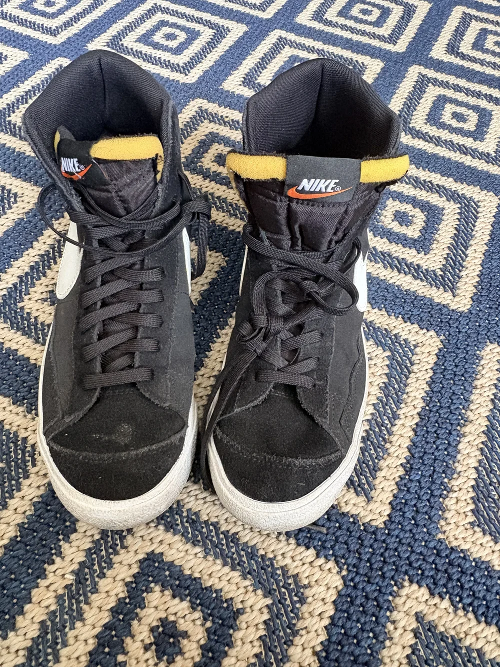 Nike Black High-Top Sneakers with White Swoosh and Yellow Accents